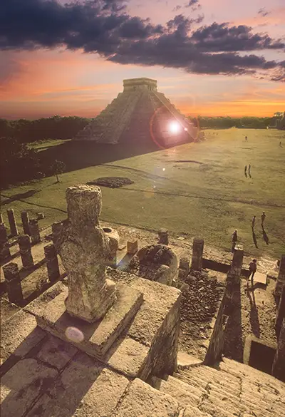 Sun setting behind the El Castillo pyramid